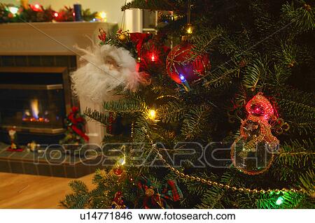 Stock Photograph - Living room with Christmas tree and fireplace. Fotosearch
