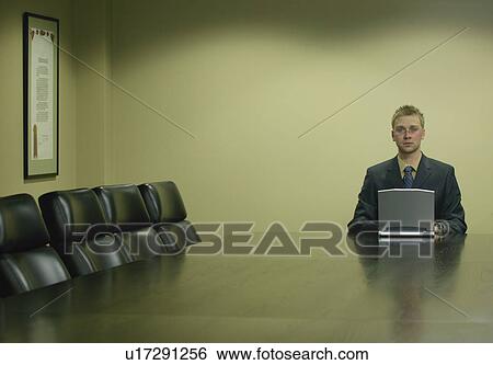 Stock Photograph - Lone businessman with laptop. Fotosearch