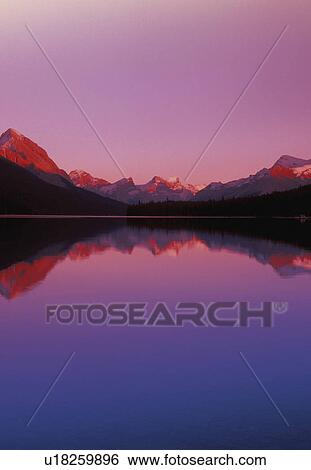 Maligne Lake and Mountains at Dusk Jasper National Park Alberta Canada View Large Photo Image Stock Photograph - Maligne Lake and Mountains at Dusk Jasper National Park Alberta Canada. Fotosearch