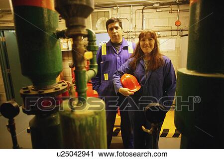 Man and woman in industry View Large Photo Image Stock Image - Man and woman in industry. Fotosearch