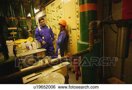 Stock Photograph - Man and woman in industry. Fotosearch