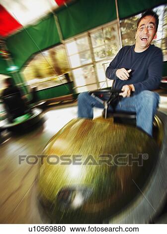 Man at amusement park View Large Photo Image Stock Image - Man at amusement park. Fotosearch