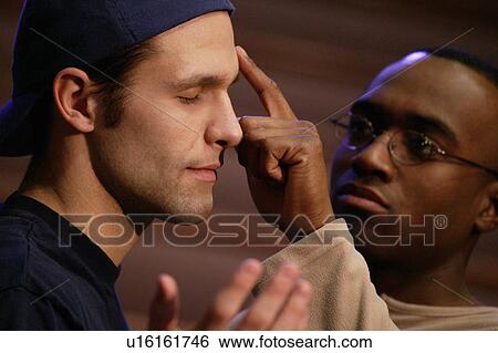 Man being anointed with oil View Large Photo Image Stock Photograph - Man being anointed with oil. Fotosearch