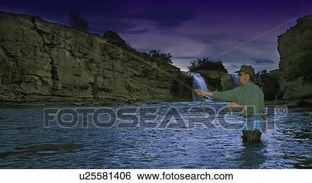 Man fly fishing in stream View Large Photo Image Stock Photograph - Man fly fishing in stream. Fotosearch