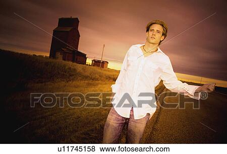 Man hitchhiking View Large Photo Image Stock Photo - Man hitchhiking. Fotosearch