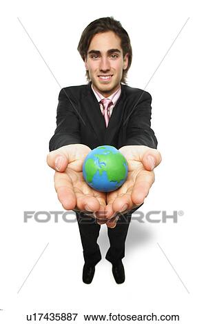 Stock Photo - Man holds the world in his hands. Fotosearch
