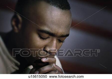 Man in prayer View Large Photo Image Stock Image - Man in prayer. Fotosearch