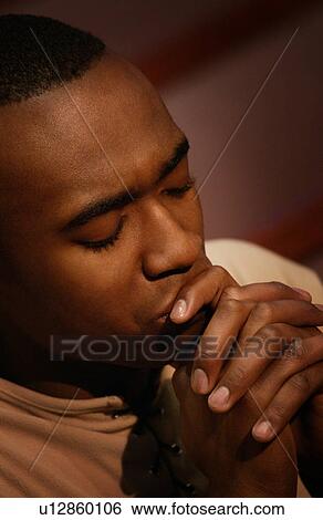 Man in prayer View Large Photo Image Stock Photograph - Man in prayer. Fotosearch