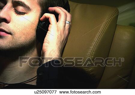 Stock Photo - Man listens to music. Fotosearch