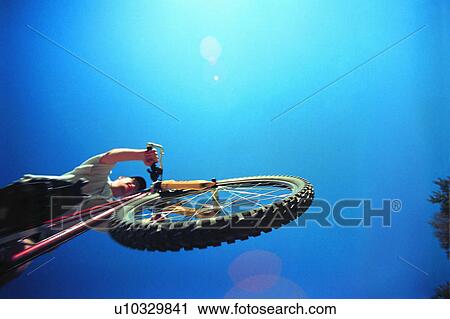 Man on a bike View Large Photo Image Stock Image - Man on a bike. Fotosearch