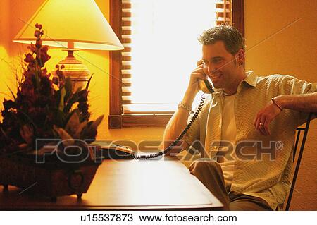 Man on telephone View Large Photo Image Stock Image - Man on telephone. Fotosearch