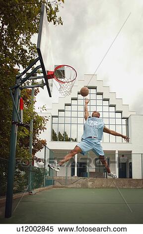Man plays basketball View Large Photo Image Stock Photography - Man plays basketball. Fotosearch