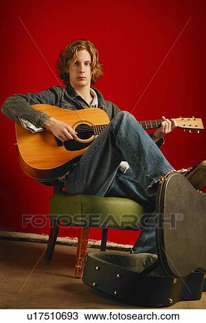 Man plays guitar View Large Photo Image Stock Image - Man plays guitar. Fotosearch
