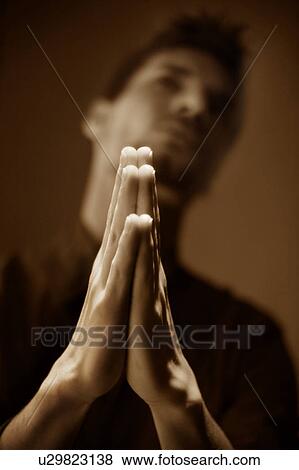Man praying View Large Photo Image Stock Photo - Man praying. Fotosearch
