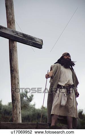 Man stands at the foot of the cross View Large Photo Image Stock Image - Man stands at the foot of the cross. Fotosearch