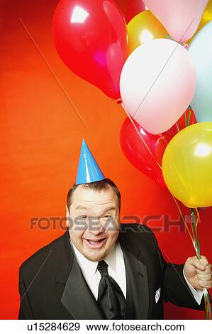 Stock Photo - Man with balloons. Fotosearch