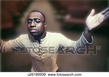 Man with hands raised in worship View Large Photo Image Stock Photo - Man with hands raised in worship. Fotosearch