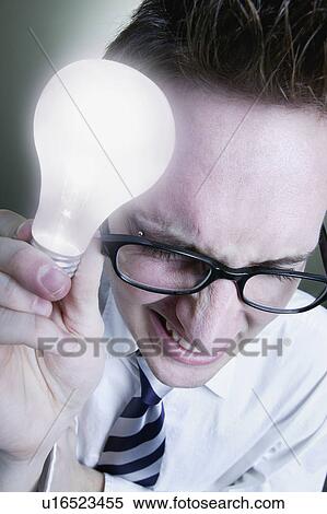 Stock Photography - Man with light bulb. Fotosearch