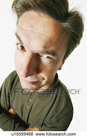 Stock Photo - Man with one eye on you. Fotosearch