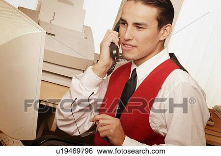 Man working on computer View Large Photo Image Stock Photograph - Man working on computer. Fotosearch