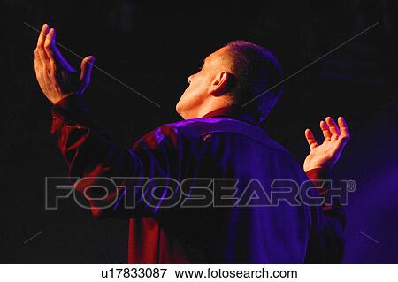 Man worshipping View Large Photo Image Stock Photo - Man worshipping. Fotosearch