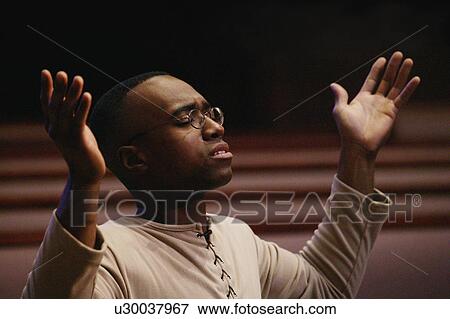 Man worshipping View Large Photo Image Stock Photo - Man worshipping. Fotosearch