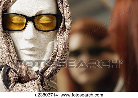 Picture - Mannequin head modeling sunglasses and scarf. Fotosearch