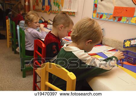 Many children drawing pictures in a kindergarten class View Large Photo Image Stock Photo - Many children drawing pictures in a kindergarten class. Fotosearch