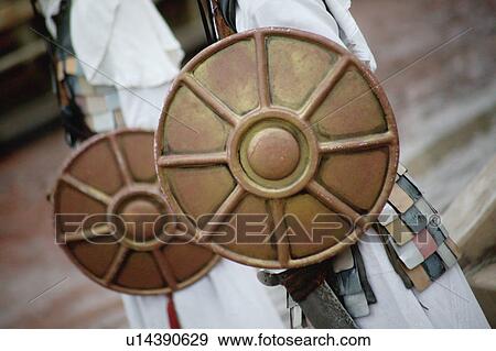 Men hold shields View Large Photo Image Stock Photo - Men hold shields. Fotosearch