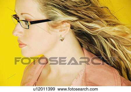 Model wearing trendy glasses View Large Photo Image Stock Photo - Model wearing trendy glasses. Fotosearch