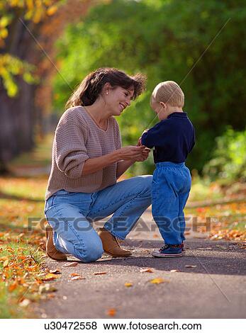 Mother and child in a park. View Large Photo Image Stock Photo - Mother and child in a park.. Fotosearch