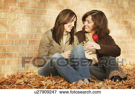 Mother and daughter share a smile View Large Photo Image Stock Photo - Mother and daughter share a smile. Fotosearch
