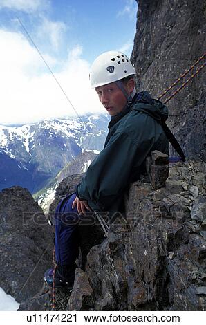 Stock Image - Mountaineer taking a rest. Fotosearch