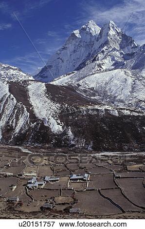 Mountainous landscape with valley and village in forefront View Large Photo Image Stock Photo - Mountainous landscape with valley and village in forefront. Fotosearch