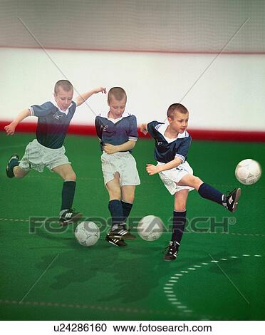 Multiple exposure of boy kicking soccer ball View Large Photo Image Stock Image - Multiple exposure of boy kicking soccer ball. Fotosearch