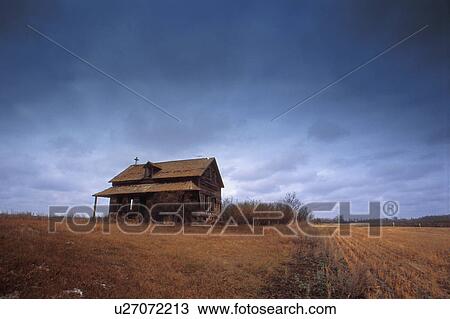 Stock Image - Old building in a field. Fotosearch