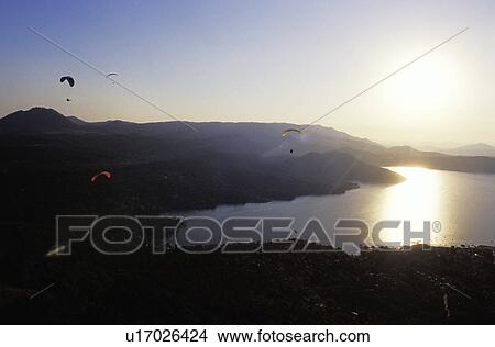 Para gliders in flight over lake View Large Photo Image Picture - Para gliders in flight over lake. Fotosearch