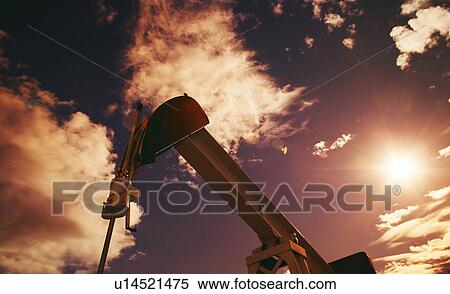 Part of oil pump against sky View Large Photo Image Stock Photography - Part of oil pump against sky. Fotosearch