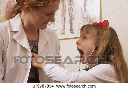 Picture - Patient examining doctor. Fotosearch