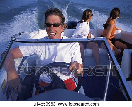 Stock Image - People on speedboat from bow of boat. Fotosearch