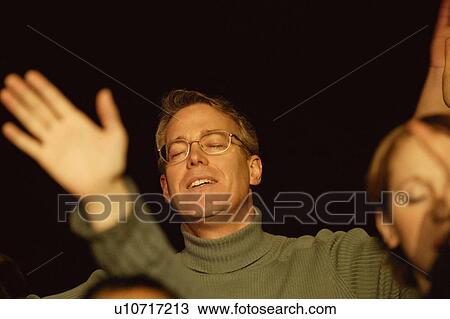 Stock Image - People worshipping. Fotosearch