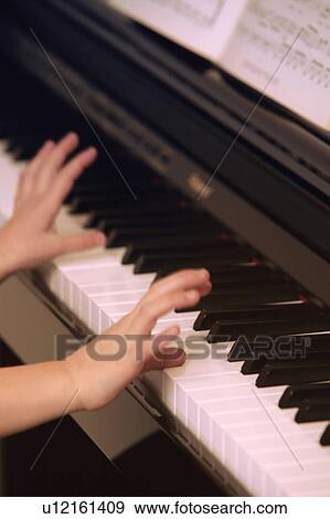 Stock Photo - Piano lessons. Fotosearch