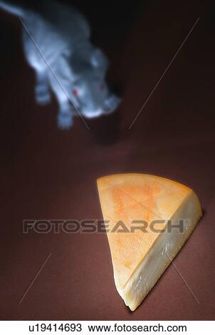 Stock Image - Piece of cheese with rodent. Fotosearch