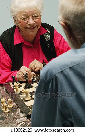Playing a game of chess View Large Photo Image Stock Photo - Playing a game of chess. Fotosearch