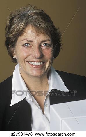 Stock Photo - Pleased businesswoman. Fotosearch