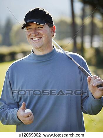 Stock Image - Portrait of a golfer. Fotosearch