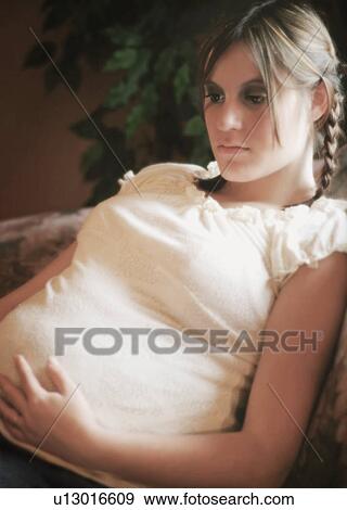 Stock Photo - Portrait of a pregnant woman. Fotosearch