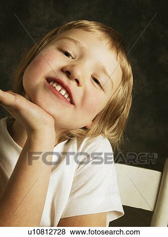 Portrait of a smiling child View Large Photo Image Stock Photo - Portrait of a smiling child. Fotosearch