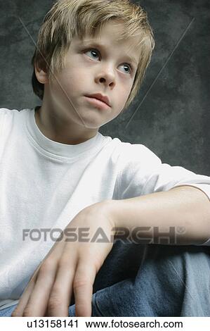 Stock Image - Portrait of a young boy. Fotosearch