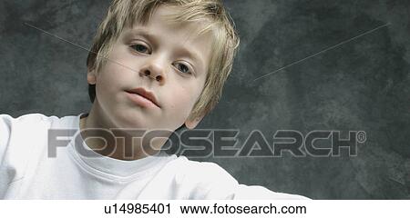 Portrait of a young boy View Large Photo Image Stock Image - Portrait of a young boy. Fotosearch